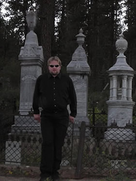 Scott in front of headstones